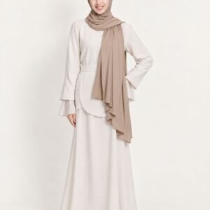 Full-length view of a woman in a flowing taupe shawl