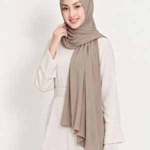 Woman in a polished taupe liquid jersey shawl styled for the office